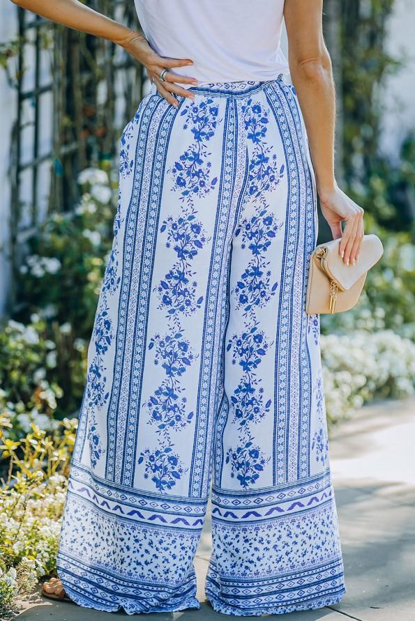 Modre široke ohlapne hlače z razrezi s cvetličnim potiskom Bella