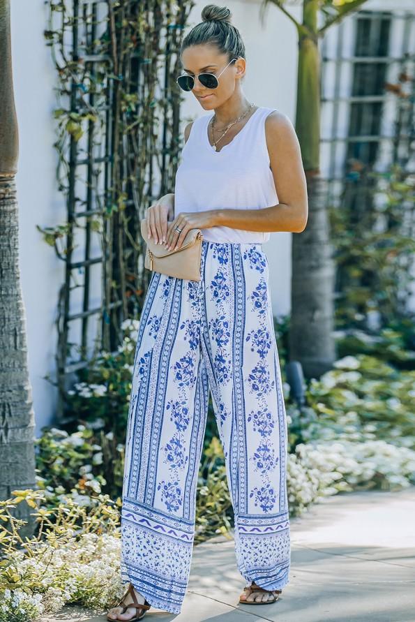 Modre široke ohlapne hlače z razrezi s cvetličnim potiskom Bella