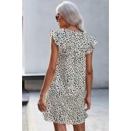 Bela pikčasta obleka z volančki