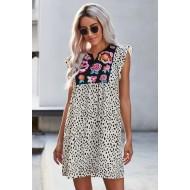 Bela pikčasta obleka z volančki